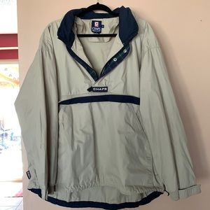 Men's pull over jacket with front pocket and rolled up hood.